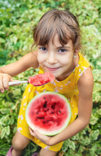 Portrait of cute girl eating food