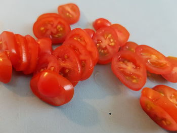 Close-up of tomatoes over white background