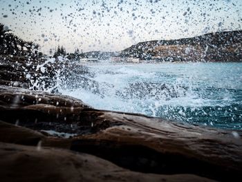 Sea waves splashing on rocks