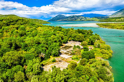 High angle view of sea and trees against sky