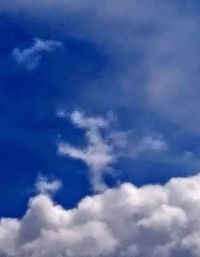 Low angle view of clouds in blue sky