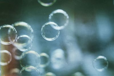 Close-up of bubbles against blurred background