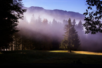 Scenic view of mountains in foggy weather