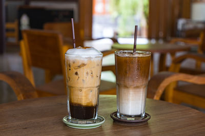 Close-up of coffee served on table at cafe