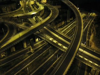 High angle view of illuminated railroad tracks at night