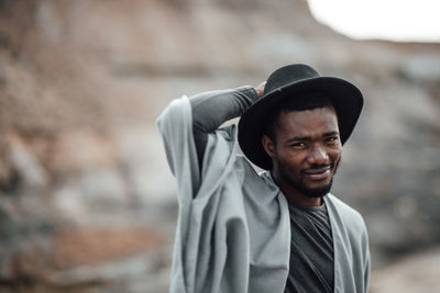 Portrait of smiling man standing outdoors