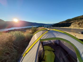 Scenic view of field against clear blue sky