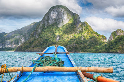 Scenic view of sea and mountains against sky