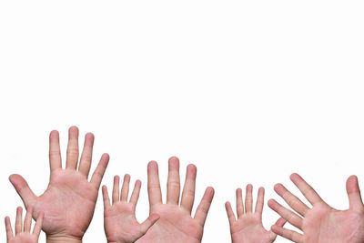 Close-up of hands over white background