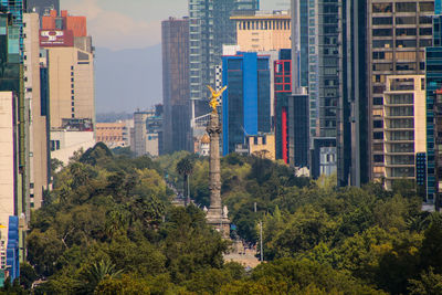 Angel of independence against buildings in city