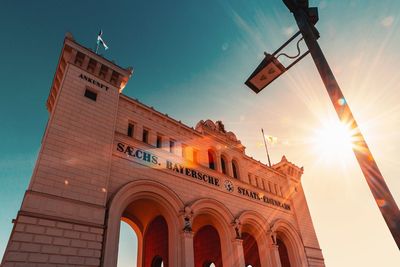 Low angle view of building against sky during sunset