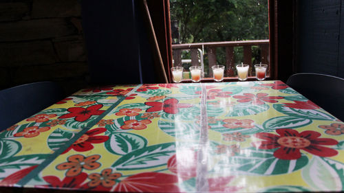 Close-up of window on table at home