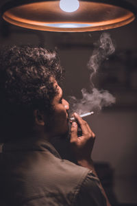 Portrait of man smoking cigarette