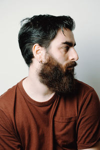 Portrait of young man against white background