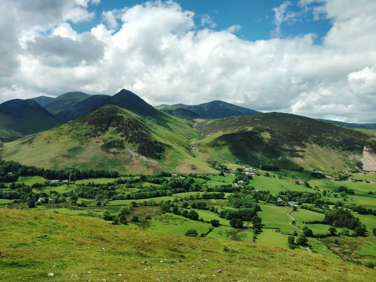 landscape, scenics, beauty in nature, agriculture, nature, tranquil scene, field, sky, cloud - sky, tranquility, mountain, rural scene, no people, green color, day, outdoors