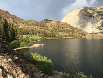 Scenic view of lake and mountains against sky