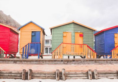 Houses in a row against buildings