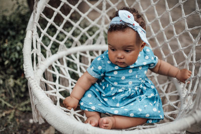 Cute baby girl looking away