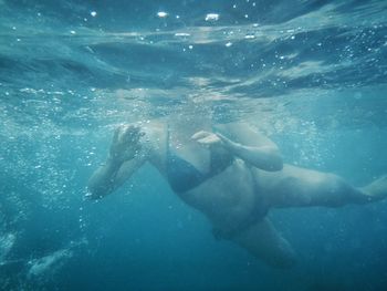 Woman swimming in sea