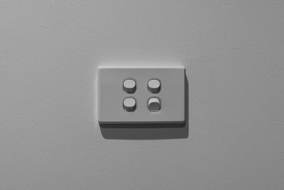 Close-up of electric lamp on wall