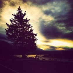 Scenic view of landscape against cloudy sky