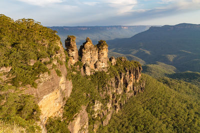 Panoramic view of trees and mountain against sky