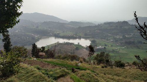 Scenic view of landscape and mountains against sky