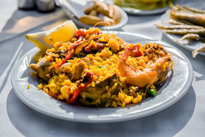 High angle view of paella served in plate on table