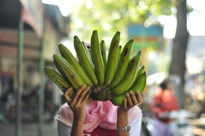 Midsection of woman holding ice cream