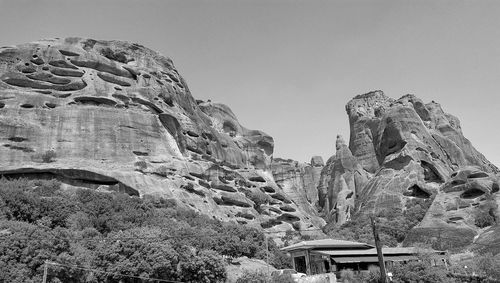 Low angle view of rock formation against sky