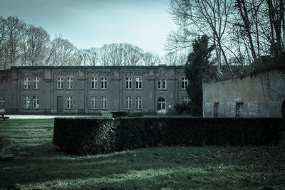 Built structure with trees in foreground