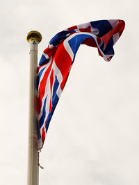 Low angle view of flag against sky