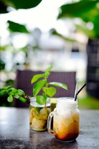 Close-up of drink in glass jar on table