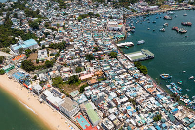 High angle view of city and buildings at waterfront