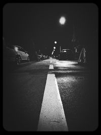 Illuminated street lights at night