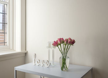 Flower vase on table at home