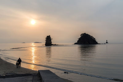 Scenic view of sea against sky at sunset