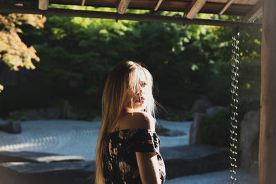 Portrait of woman standing outdoors