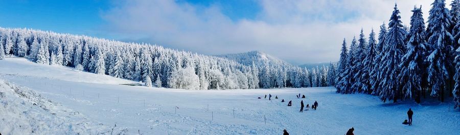 Panoramic view of snowcapped mountains against sky