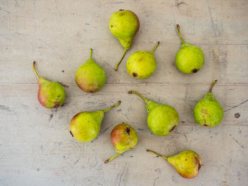 High angle view of a bunch of pears on a wooden surface