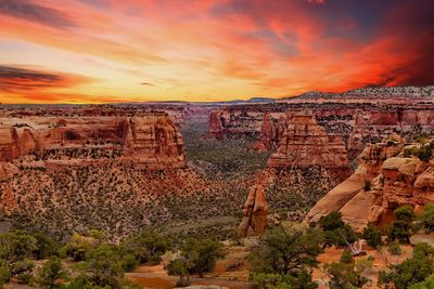 Panoramic view of rock formations against sky during sunset