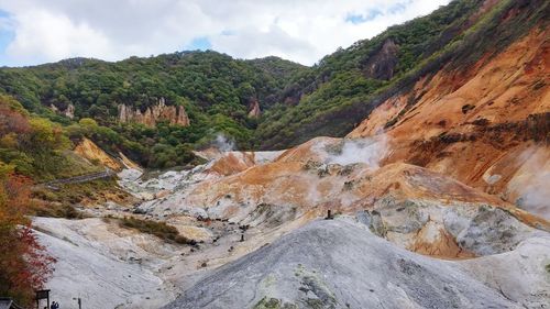 Narrow road along countryside landscape