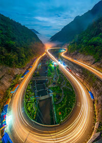 High angle view of light trails on road