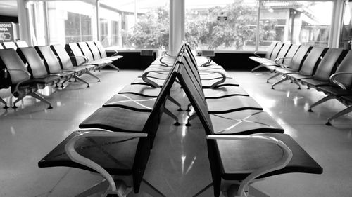 Empty chairs and tables in restaurant