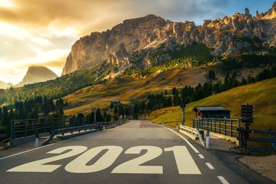 Road amidst mountains against sky