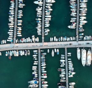 High angle view of marina on river against buildings in city