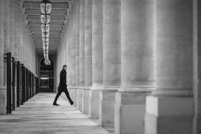 Full length of woman walking on footbridge