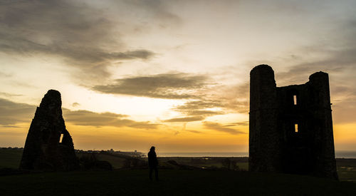 Silhouette temple against sky during sunset