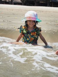 Portrait of a smiling girl in water