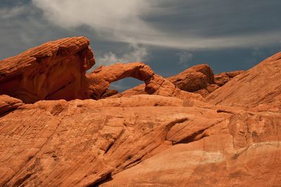 Sand dunes in desert against sky